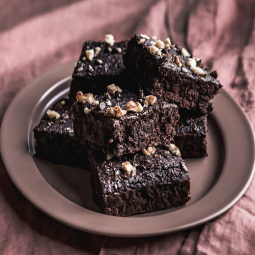 beet brownies on a pink plate